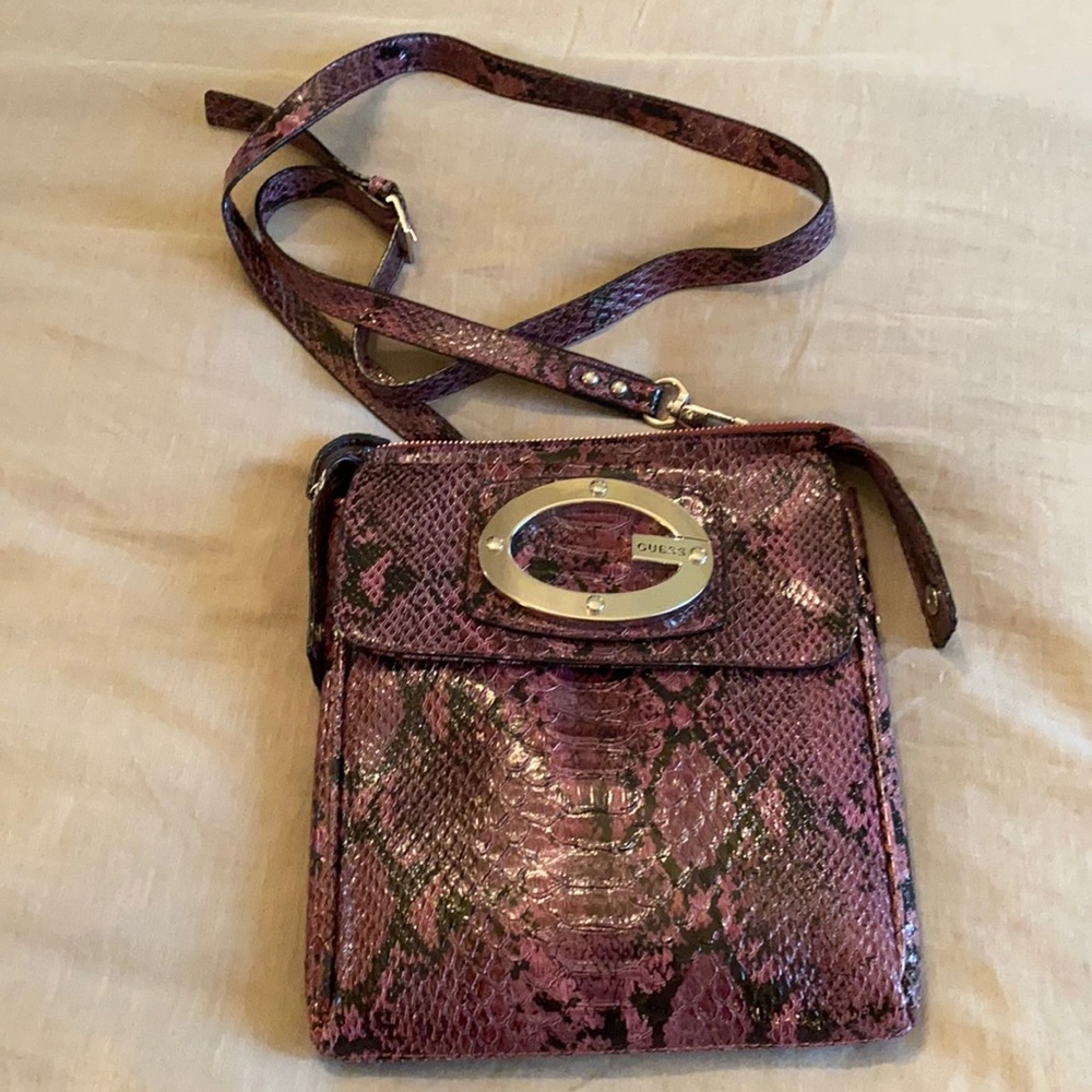 Purple crossbody python pattern Guess bag.
